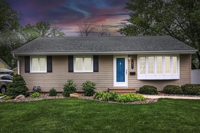 1821 4th Ave NE, Austin, MN 55912 - single story home featuring a lawn and roof with shingles