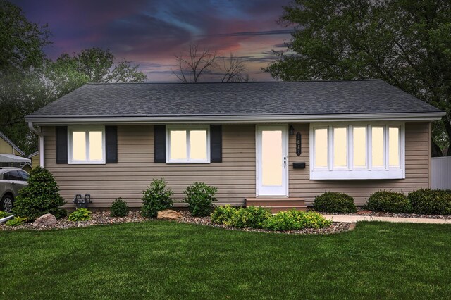 1821 4th Ave NE, Austin, MN 55912 - single story home with a front lawn and a shingled roof