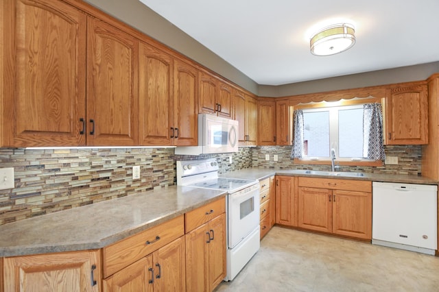 1821 4th Ave NE, Austin, MN 55912 - kitchen with white appliances, a sink, tasteful backsplash, and brown cabinetry