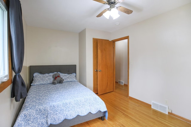 1821 4th Ave NE, Austin, MN 55912 - bedroom featuring light wood finished floors, ceiling fan, and baseboards
