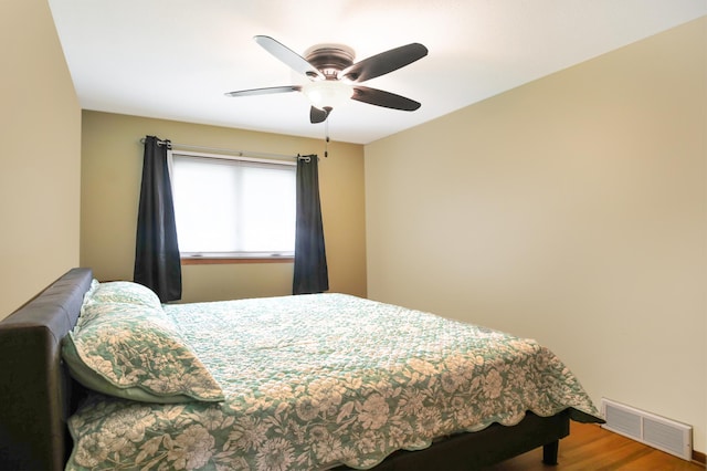 1821 4th Ave NE, Austin, MN 55912 - bedroom with wood finished floors and a ceiling fan