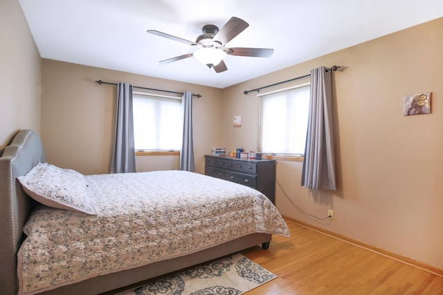 1821 4th Ave NE, Austin, MN 55912 - bedroom with light wood-style floors, baseboards, and a ceiling fan