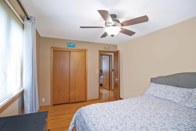 1821 4th Ave NE, Austin, MN 55912 - bedroom featuring light wood finished floors, ceiling fan, and a closet
