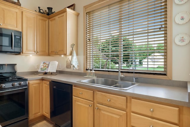 14925 Hillside Trl, Savage, MN 55378 - kitchen featuring gas range oven, a sink, light brown cabinets, and plenty of natural light