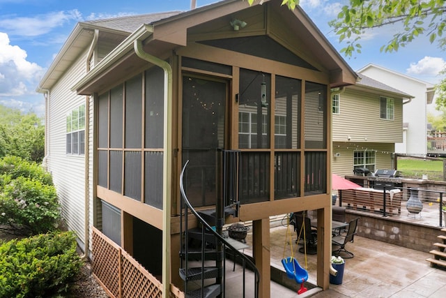 14925 Hillside Trl, Savage, MN 55378 - back of house with a sunroom and a patio area