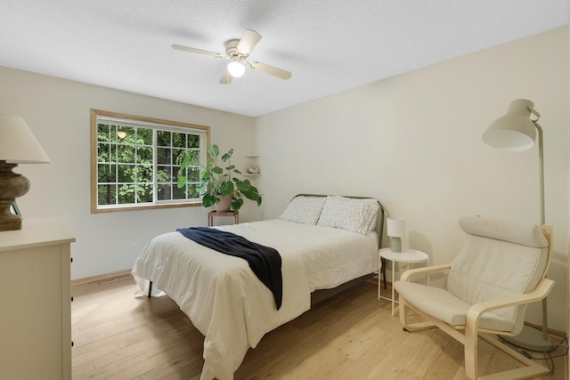 14925 Hillside Trl, Savage, MN 55378 - bedroom featuring wood finished floors, baseboards, and a ceiling fan