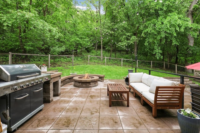 14925 Hillside Trl, Savage, MN 55378 - fenced backyard featuring a patio, an outdoor living space with a fire pit, and area for grilling