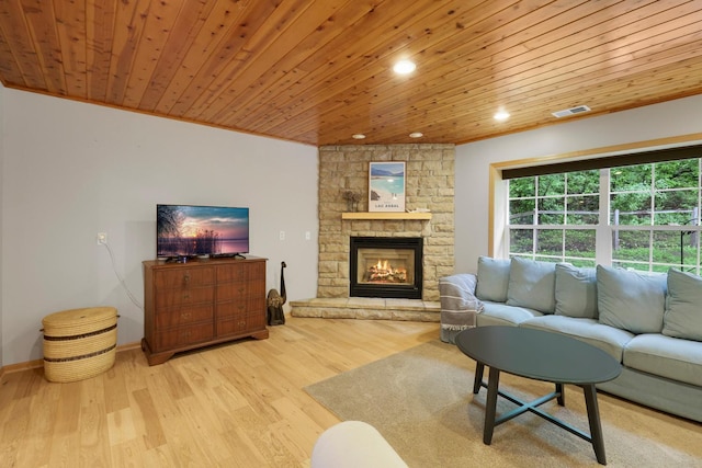 14925 Hillside Trl, Savage, MN 55378 - living area featuring wooden ceiling, a stone fireplace, recessed lighting, light wood finished floors, and baseboards