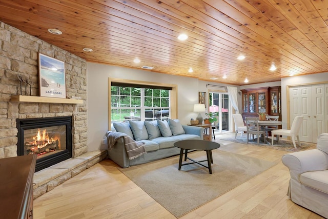 14925 Hillside Trl, Savage, MN 55378 - living room featuring a stone fireplace, wood finished floors, wood ceiling, and recessed lighting