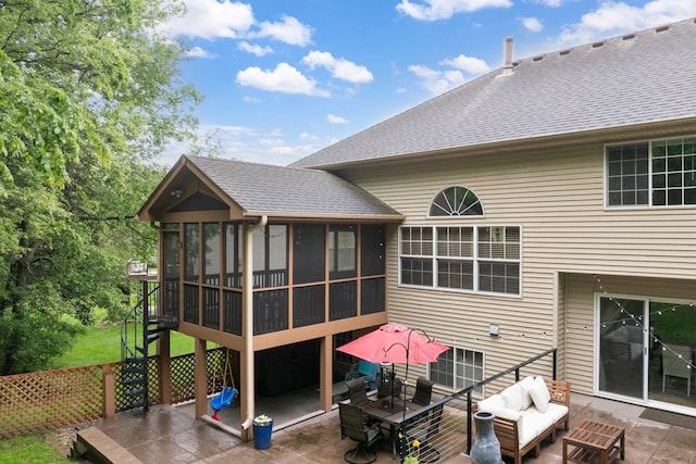 14925 Hillside Trl, Savage, MN 55378 - rear view of house with a sunroom, outdoor lounge area, a patio area, and a shingled roof