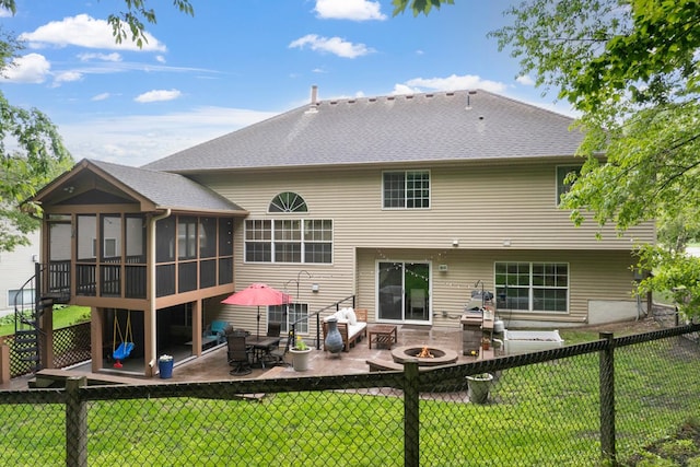 14925 Hillside Trl, Savage, MN 55378 - back of property with a patio, a sunroom, a fire pit, and roof with shingles
