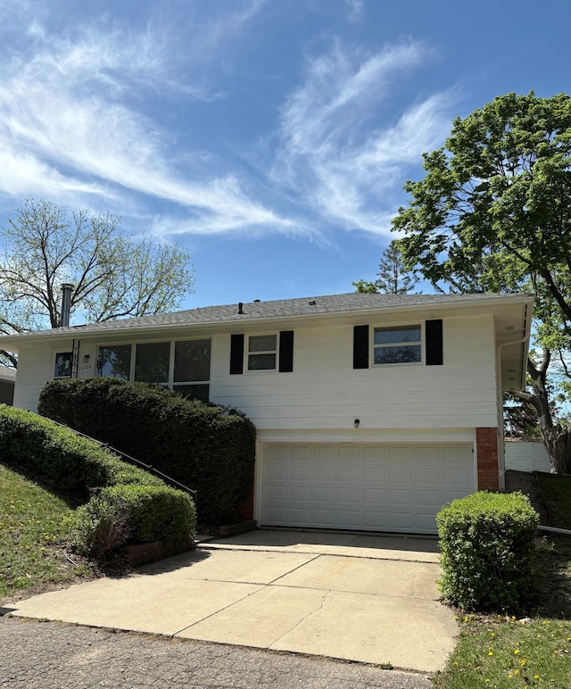 2220 23rd St NW, Rochester, MN 55901 - view of front of property featuring an attached garage, driveway, and brick siding