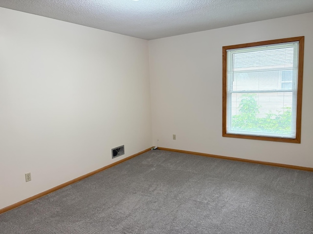 2220 23rd St NW, Rochester, MN 55901 - carpeted spare room with baseboards and a textured ceiling