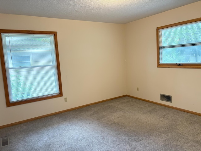 2220 23rd St NW, Rochester, MN 55901 - carpeted spare room featuring baseboards