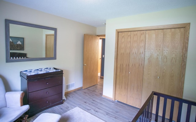 450 Meadow Ln, Somerset, WI 54025 - bedroom with wood finished floors, a closet, and baseboards