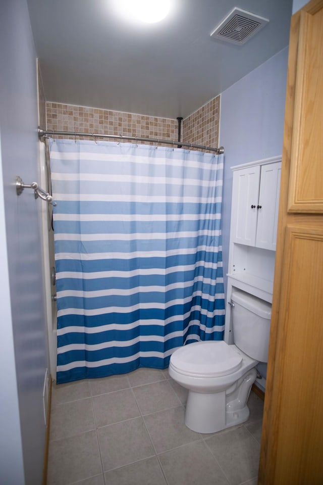 450 Meadow Ln, Somerset, WI 54025 - bathroom featuring toilet, tile patterned flooring, and curtained shower