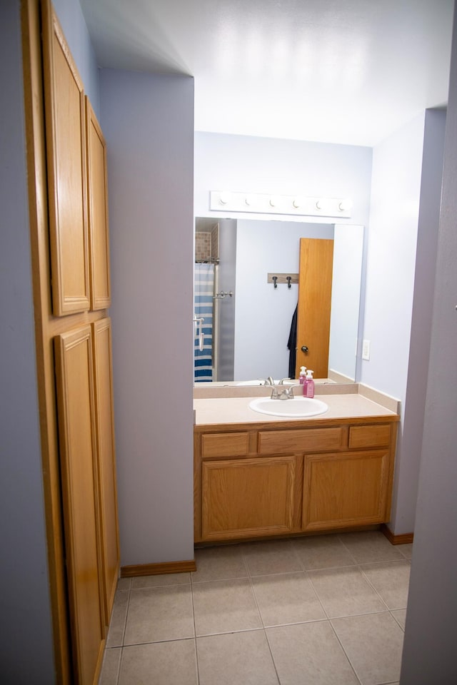 450 Meadow Ln, Somerset, WI 54025 - bathroom featuring vanity, tile patterned floors, and baseboards