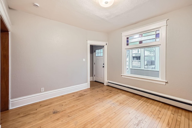 1156 Marion St, Saint Paul, MN 55117 - unfurnished room with baseboard heating, hardwood / wood-style floors, a smoke detector, and baseboards