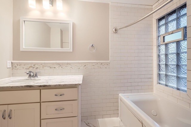 1156 Marion St, Saint Paul, MN 55117 - full bathroom featuring tile walls, a bath, vanity, and wainscoting