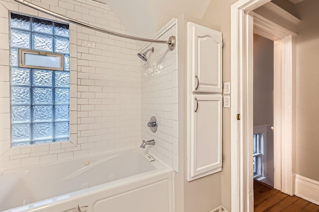 1156 Marion St, Saint Paul, MN 55117 - bathroom with shower / tub combination, baseboards, plenty of natural light, and wood finished floors