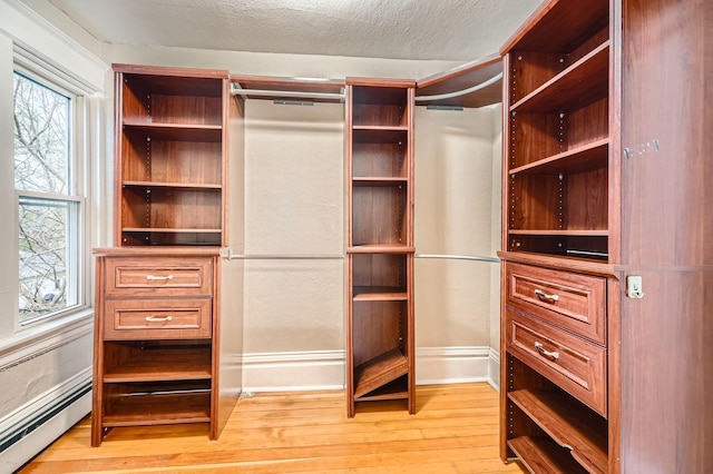 1156 Marion St, Saint Paul, MN 55117 - spacious closet with baseboard heating and light wood-type flooring
