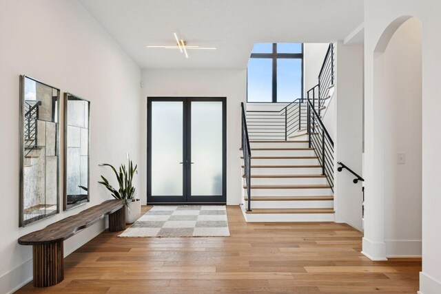 6297 Yuma Ln N, Maple Grove, MN 55311 - entryway with french doors, wood finished floors, stairs, and baseboards