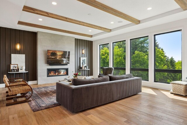 6297 Yuma Ln N, Maple Grove, MN 55311 - living area featuring beamed ceiling, a fireplace, and light wood-style floors
