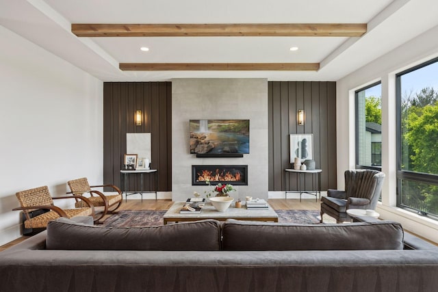 6297 Yuma Ln N, Maple Grove, MN 55311 - living room featuring wood finished floors, beam ceiling, a fireplace, and recessed lighting