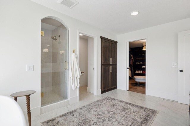 6297 Yuma Ln N, Maple Grove, MN 55311 - full bath featuring a stall shower, a spacious closet, baseboards, and recessed lighting