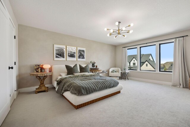 6297 Yuma Ln N, Maple Grove, MN 55311 - carpeted bedroom with a chandelier and baseboards