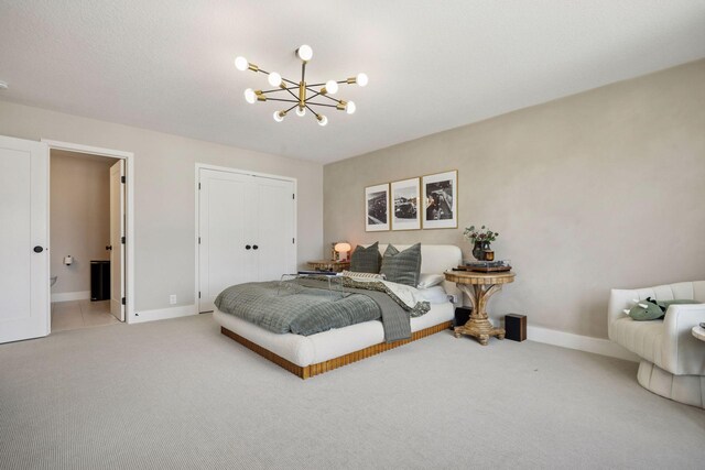 6297 Yuma Ln N, Maple Grove, MN 55311 - bedroom featuring a chandelier, light colored carpet, baseboards, and a closet