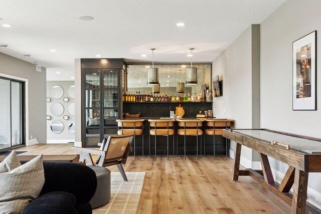 6297 Yuma Ln N, Maple Grove, MN 55311 - indoor dry bar featuring wood finished floors, recessed lighting, and baseboards