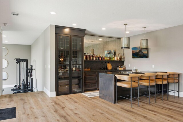 6297 Yuma Ln N, Maple Grove, MN 55311 - indoor wet bar with wood finished floors, recessed lighting, pendant lighting, and baseboards