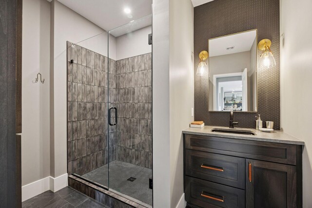 6297 Yuma Ln N, Maple Grove, MN 55311 - bathroom with baseboards, a shower stall, and vanity