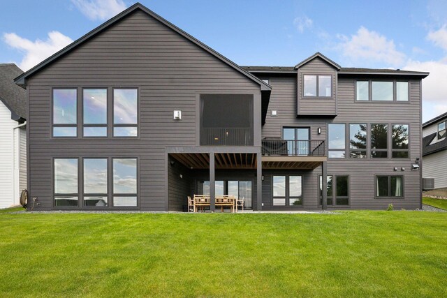 6297 Yuma Ln N, Maple Grove, MN 55311 - back of house featuring a lawn and a balcony