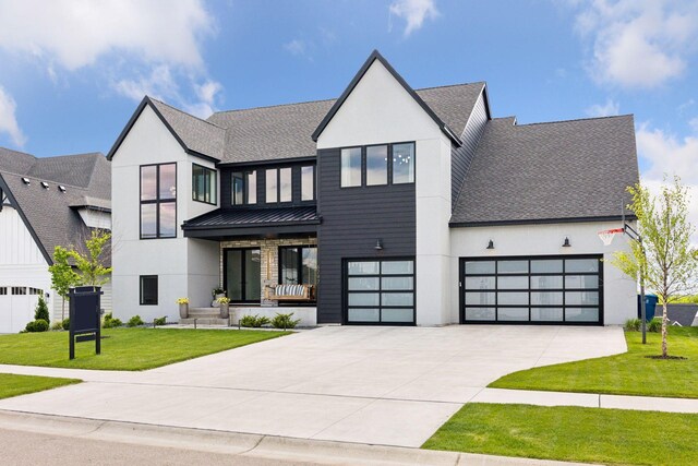 6297 Yuma Ln N, Maple Grove, MN 55311 - view of front of property with driveway, a standing seam roof, a front yard, and a shingled roof