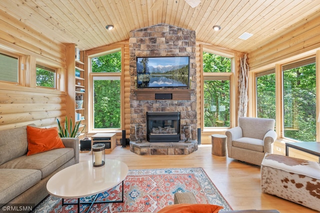 12143 Gantry Ln, Apple Valley, MN 55124 - living area featuring wooden ceiling, lofted ceiling, wood finished floors, a stone fireplace, and log walls