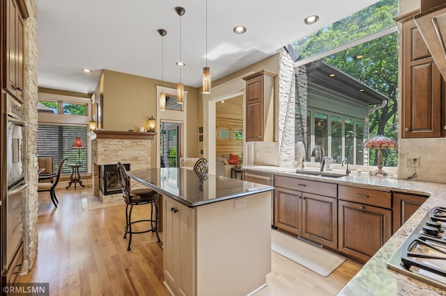 12143 Gantry Ln, Apple Valley, MN 55124 - kitchen with a sink, appliances with stainless steel finishes, healthy amount of natural light, tasteful backsplash, and recessed lighting