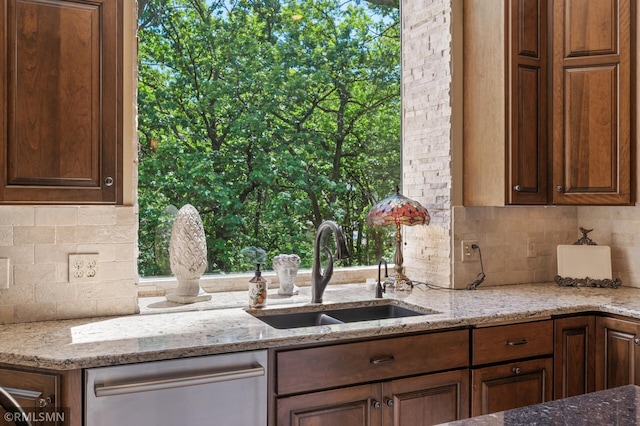 12143 Gantry Ln, Apple Valley, MN 55124 - kitchen with a sink, dishwasher, tasteful backsplash, and light stone countertops