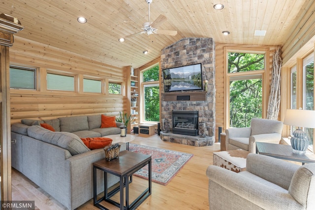 12143 Gantry Ln, Apple Valley, MN 55124 - living room with wooden ceiling, log walls, a stone fireplace, recessed lighting, and wood finished floors