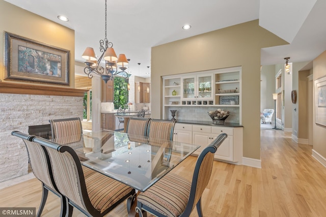 12143 Gantry Ln, Apple Valley, MN 55124 - dining room featuring a chandelier, light wood-style flooring, baseboards, and recessed lighting