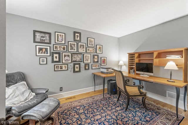 12143 Gantry Ln, Apple Valley, MN 55124 - office area with wood finished floors and baseboards