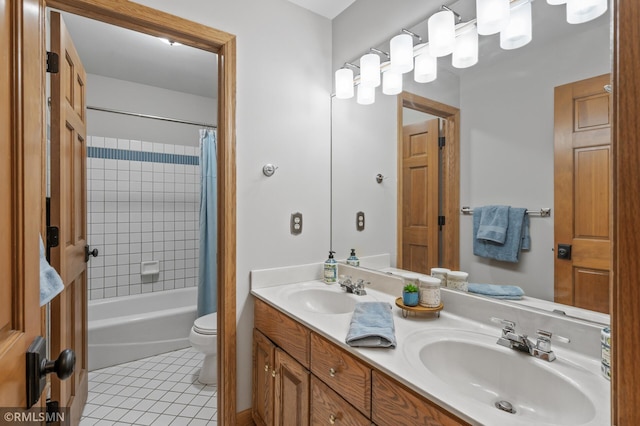 12143 Gantry Ln, Apple Valley, MN 55124 - bathroom with tile patterned floors, double vanity, shower / tub combo with curtain, and toilet