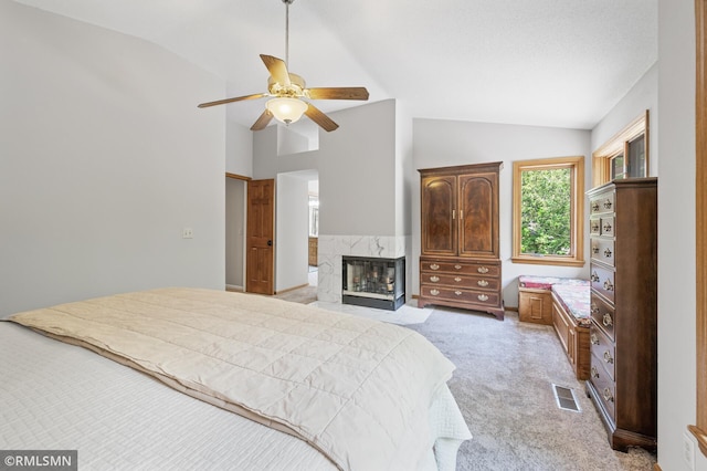 12143 Gantry Ln, Apple Valley, MN 55124 - bedroom featuring lofted ceiling, light colored carpet, a premium fireplace, and ceiling fan