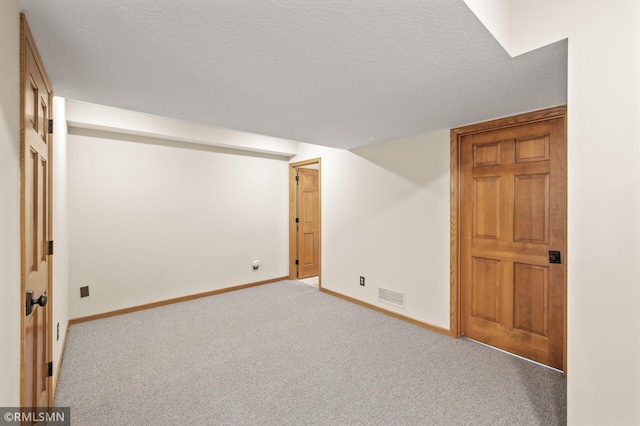 12143 Gantry Ln, Apple Valley, MN 55124 - finished basement with baseboards, a textured ceiling, and carpet flooring