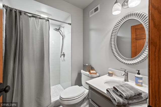 12143 Gantry Ln, Apple Valley, MN 55124 - bathroom featuring vanity, toilet, and a tile shower