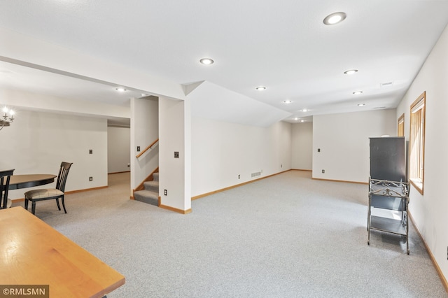 12143 Gantry Ln, Apple Valley, MN 55124 - unfurnished living room with light colored carpet, baseboards, stairs, recessed lighting, and a chandelier