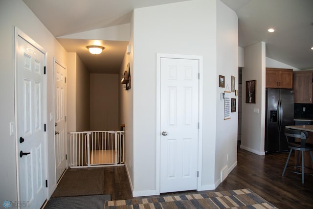 2700 14th St W, West Fargo, ND 58078 - hall featuring vaulted ceiling, dark wood-type flooring, baseboards, and recessed lighting