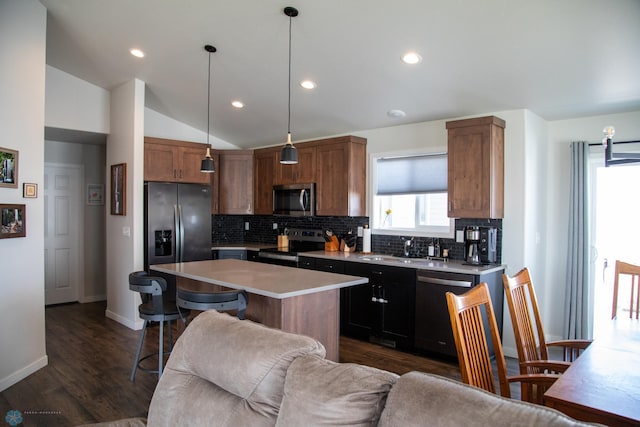 2700 14th St W, West Fargo, ND 58078 - kitchen with stainless steel appliances, tasteful backsplash, open floor plan, light countertops, and lofted ceiling