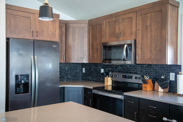 2700 14th St W, West Fargo, ND 58078 - kitchen with stainless steel appliances, light countertops, backsplash, and lofted ceiling